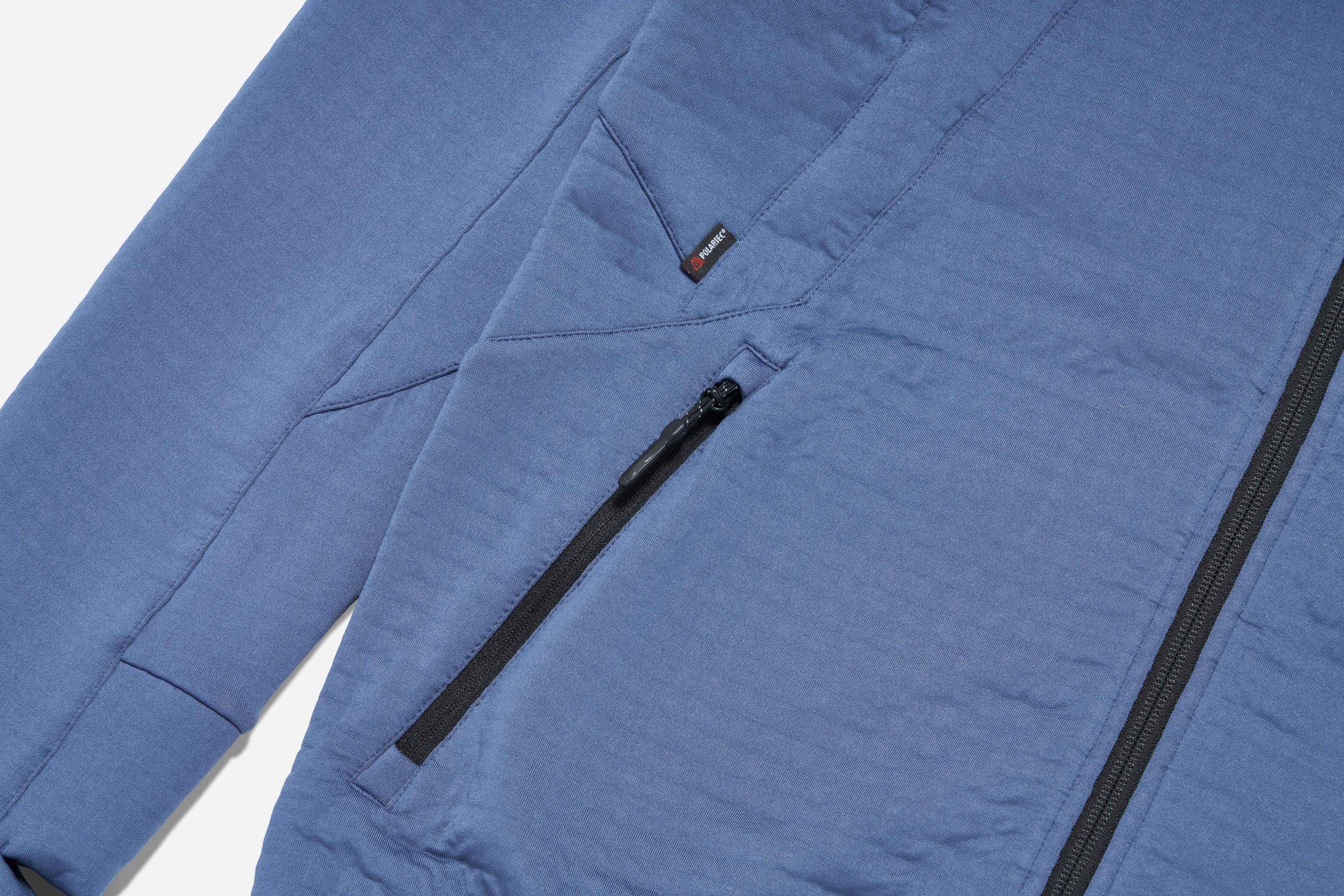 Product shot the the Nox Hoodie in vintage blue focusing on the zip and sleeve